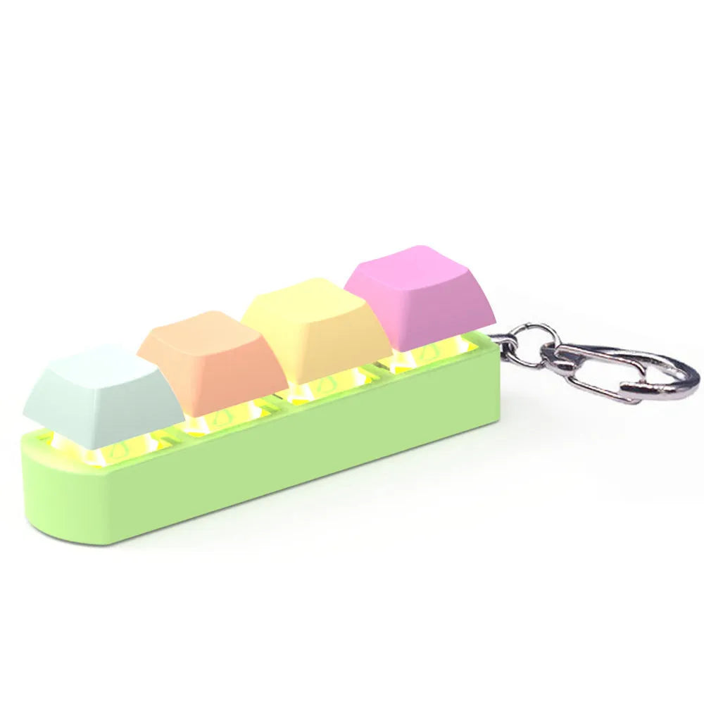 4-key mechanical keyboard switch tester in assorted colours on a desk