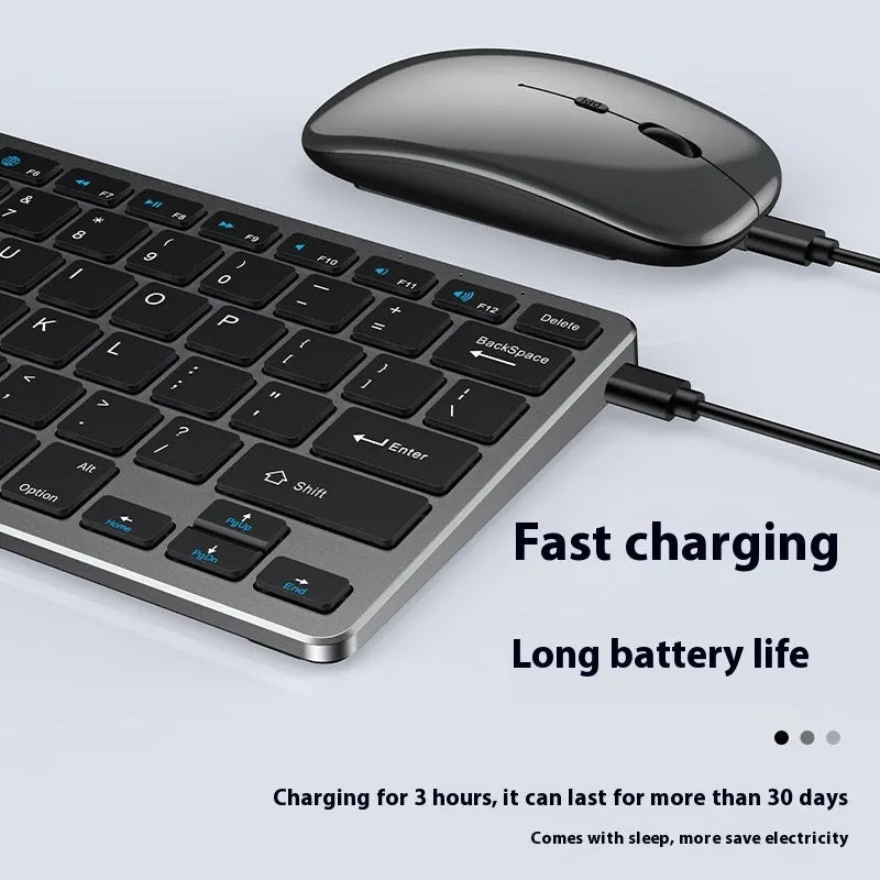 Rechargeable black ultra-thin wireless keyboard and mouse set with USB receiver and protective cover on a desk.