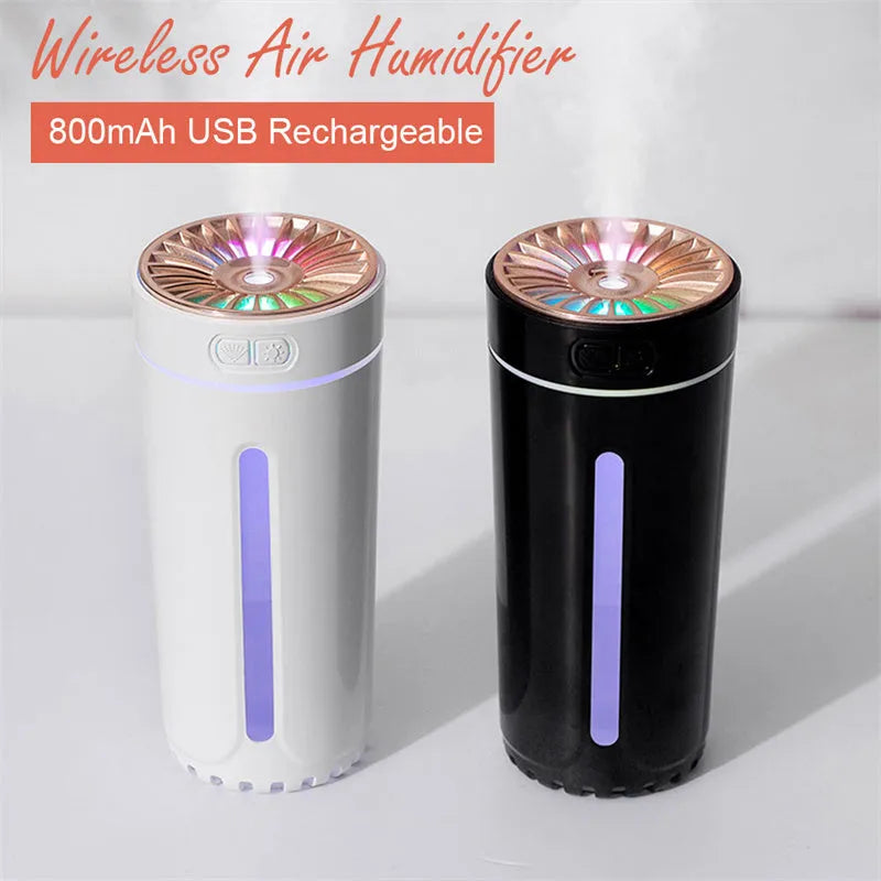 Black portable USB humidifier with colourful lights on a car cup holder.