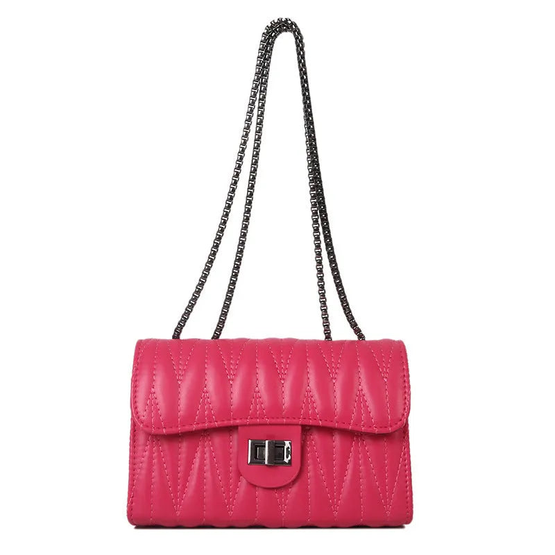 Women's small retro textured square shoulder bag in PU showing interior phone pocket and soft handle.
