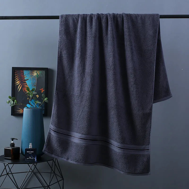 Pure cotton three-piece towel set showing bath towel, hand towel, and face cloth in blue colour