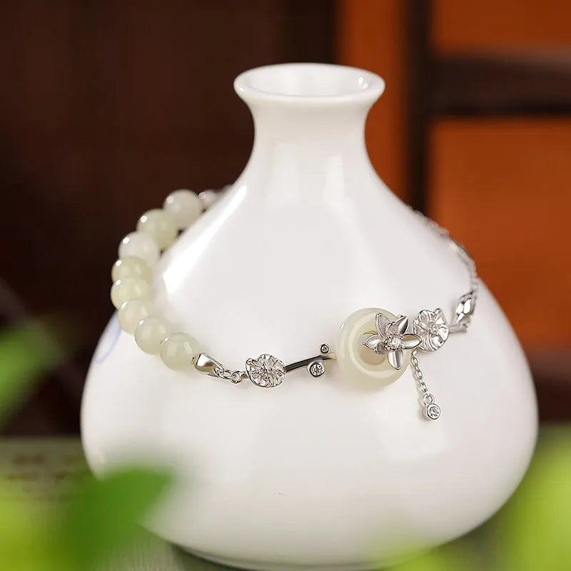 Women's Hetian jade lotus peace buckle bracelet in 925 silver with antique gold or silver plating