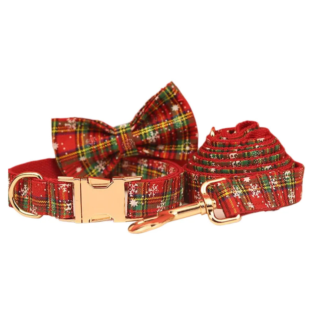 Red snowflake Christmas pet collar with plaid leash, bow, and vest four-piece holiday outfit set for dogs
