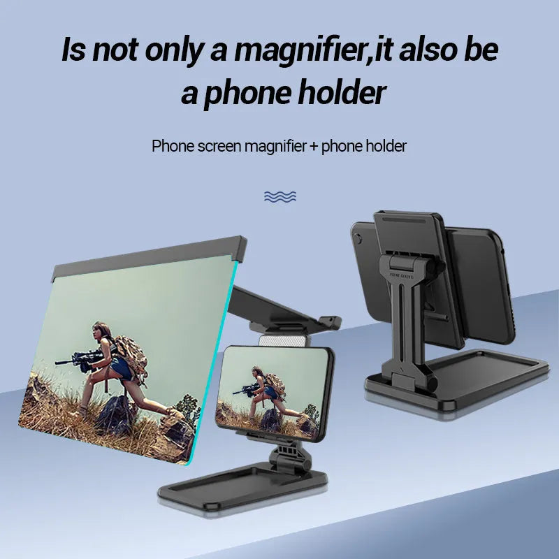 Black folding mobile phone screen magnifier with detachable holder on a desk.