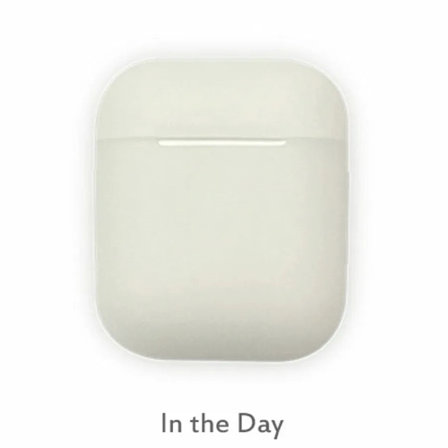 Luminous solid colour silicone flip-top protective case for AirPods on a white background.