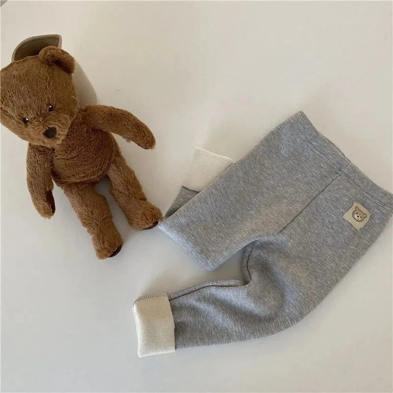 Girl's high-waist fleece-lined winter leggings in solid colour with wool lining and hair band belt.