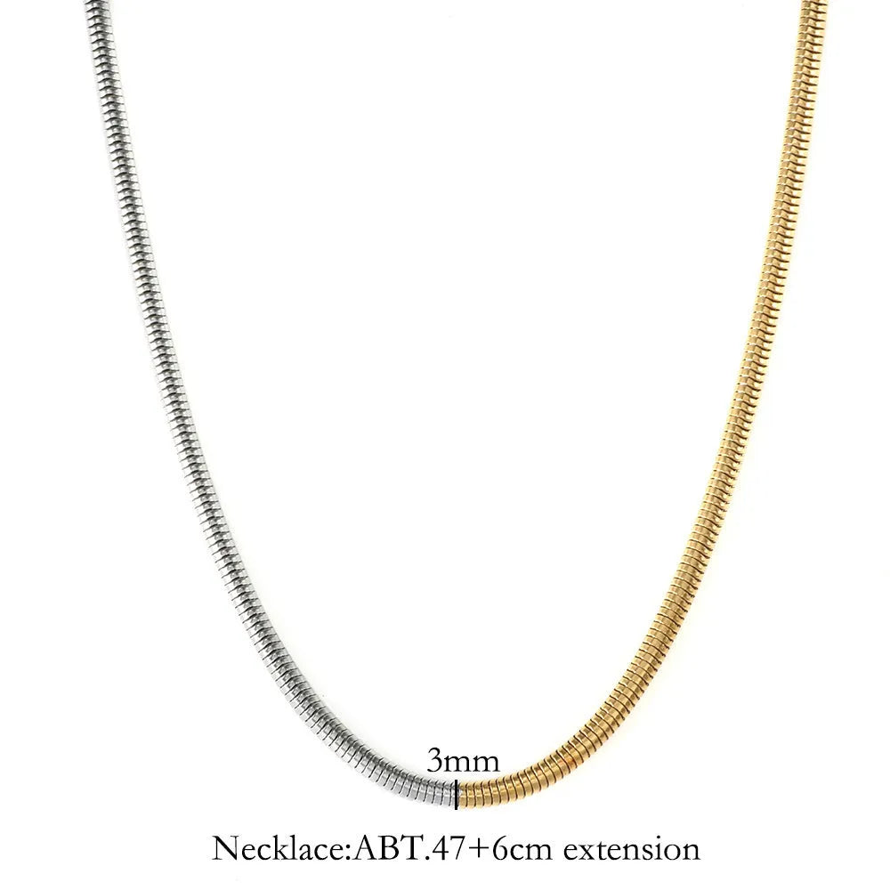 Gold-colour women's snake bones chain necklace with geometric alloy pendant, 3mm wide.
