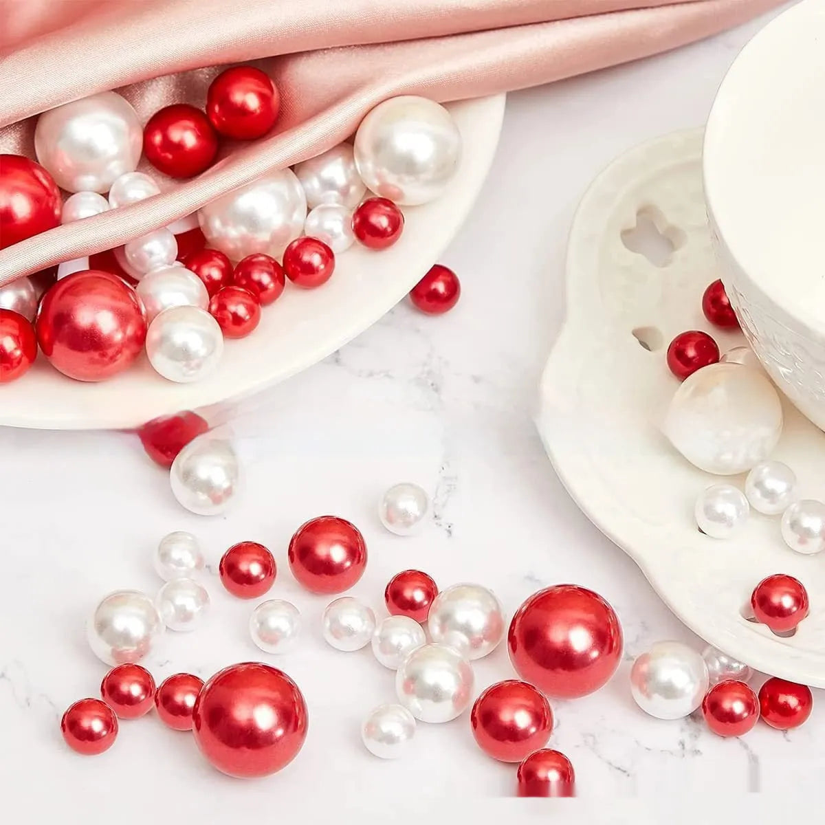 Two red suit floating stuffed vase Christmas decorations with plastic floating filling vase on a table