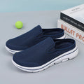 Women's light grey mesh toe holder slippers with a flat sole on a white background.