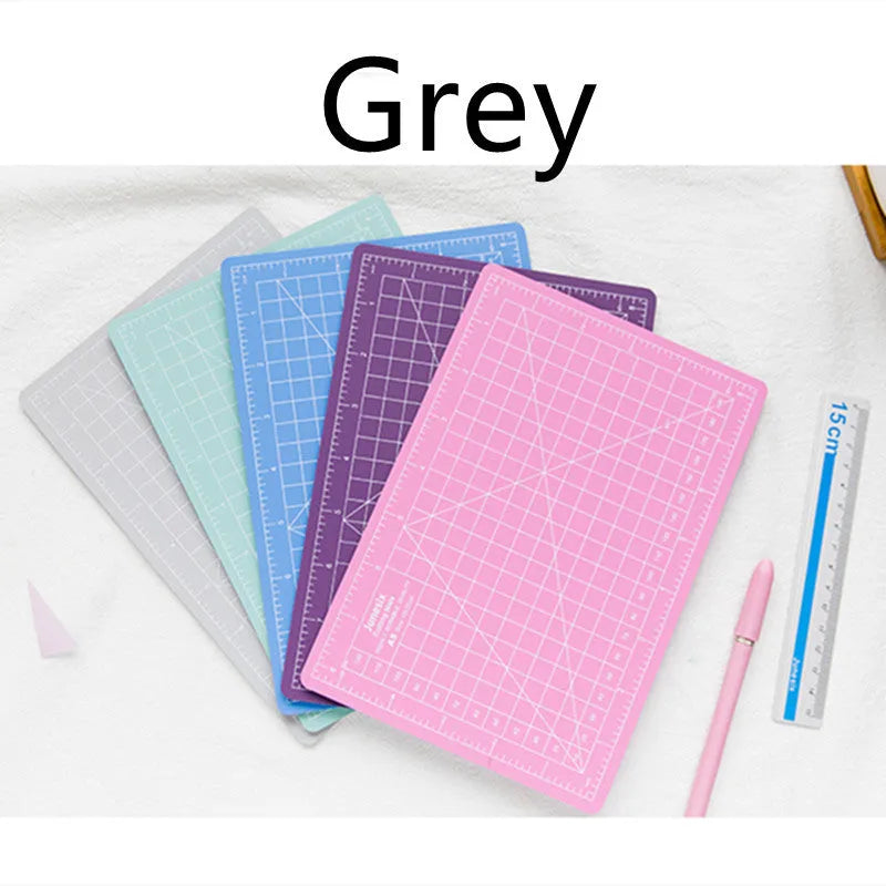 Art pen knife cutting board set in chosen colour with backing board, ruler, pen sharpener, and blade.