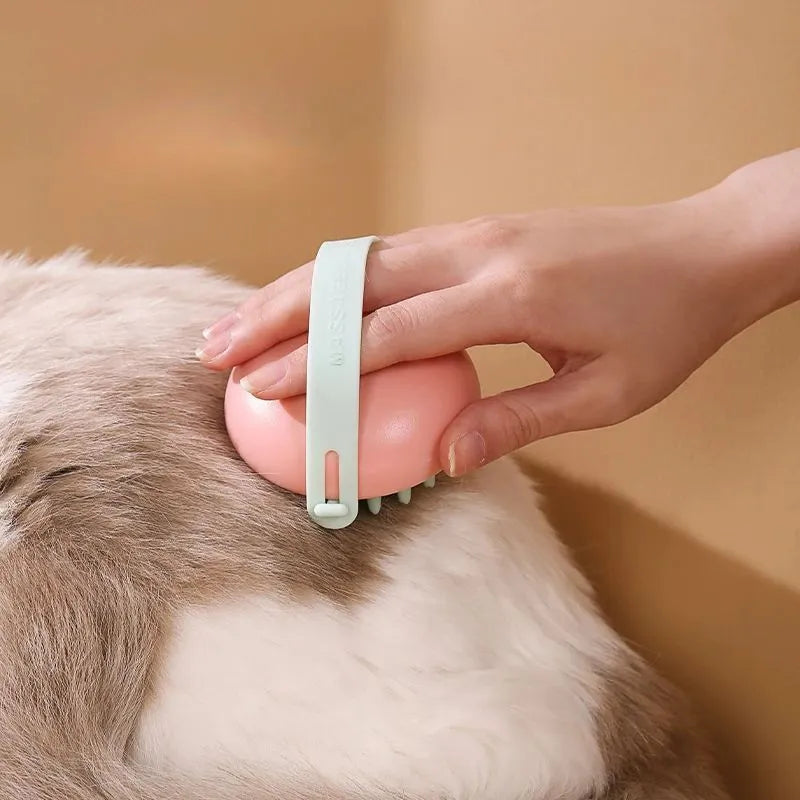 Blue silicone pet bathing brush with soft bristles and ergonomic handle for cats and dogs.