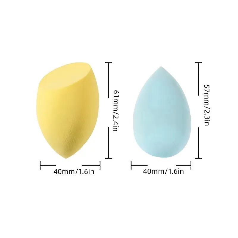 Set of seven differently shaped makeup sponges in various colours on pink background