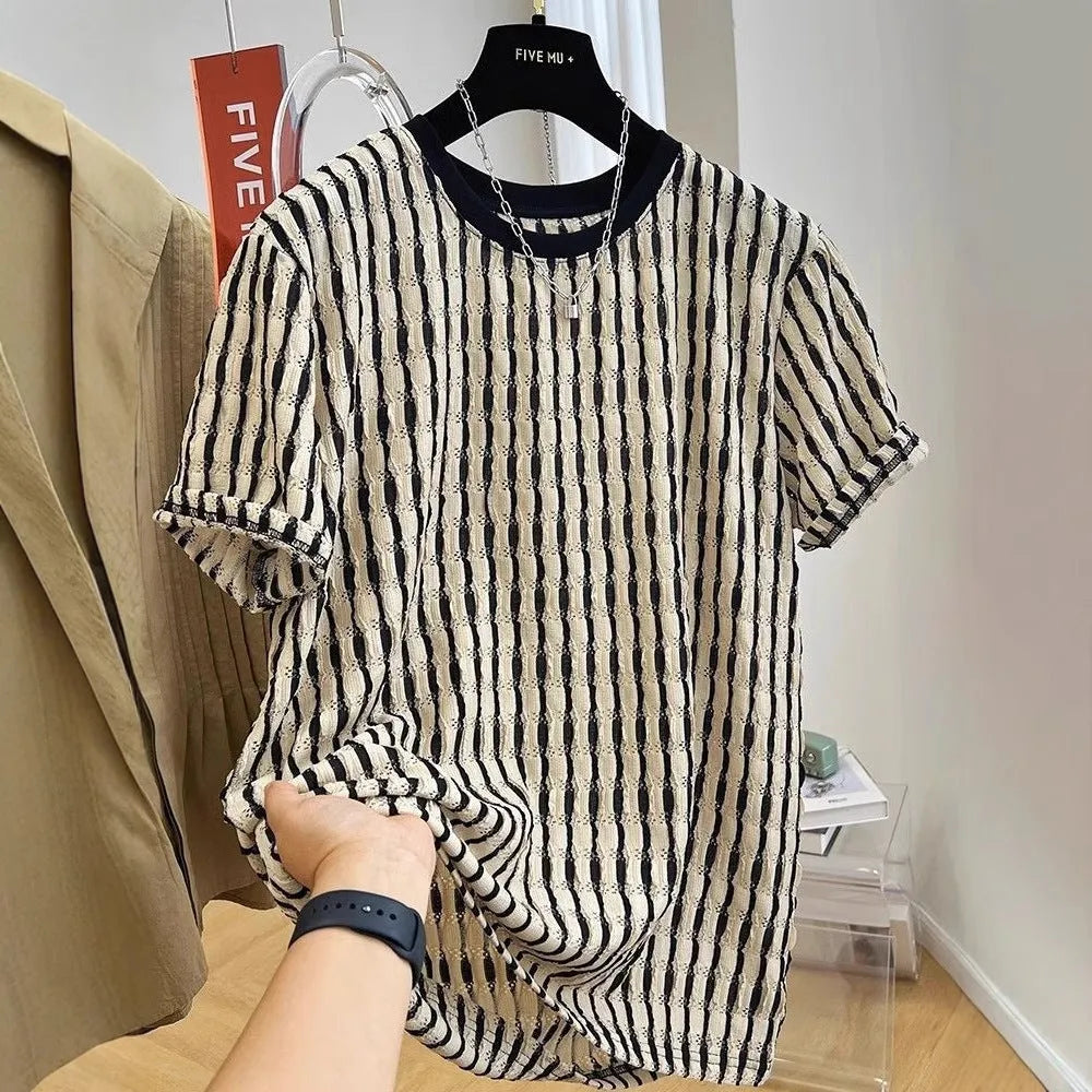 Black and white striped men's loose fit short sleeve pullover shirt made from linen silk blend fabric.
