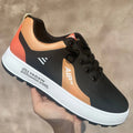 Men's white casual sports shoes with round toe and choice of orange, black, or brown accents on artificial PU upper.