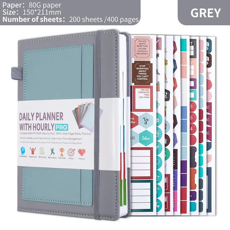 No date notebook with elastic strap in purple PU leather cover showing thread binding and planning stickers