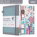 No date notebook with elastic strap in purple PU leather cover showing thread binding and planning stickers