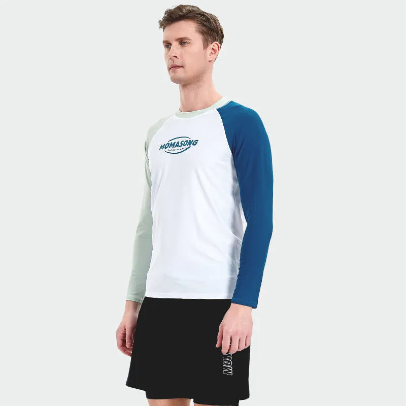 Men's white long-sleeved swim top with colour-matched beach swim trunks set on a beach.