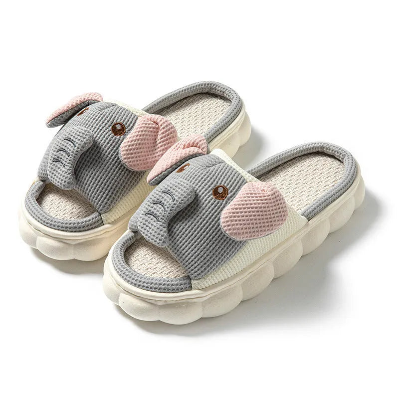 Elephant grey open-toe linen slippers for couples on a plain background, showing sewn sole detail.