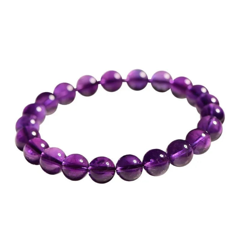 Natural Uruguay amethyst scattered bead bracelet showing purple gemstone beads on a string.