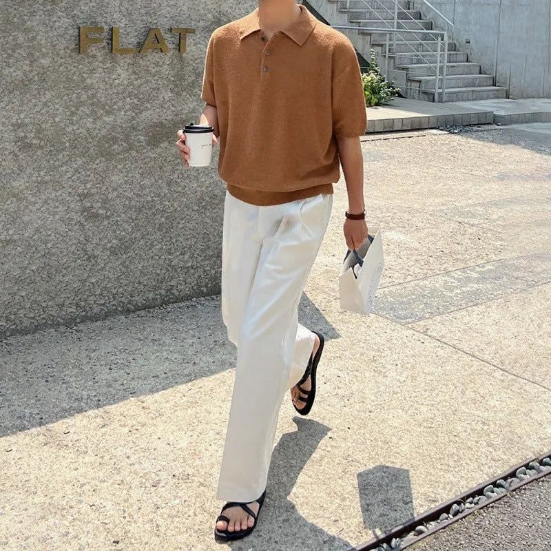 A man's caramel coloured retro knitted polo shirt with short sleeves and an asymmetric design detail.