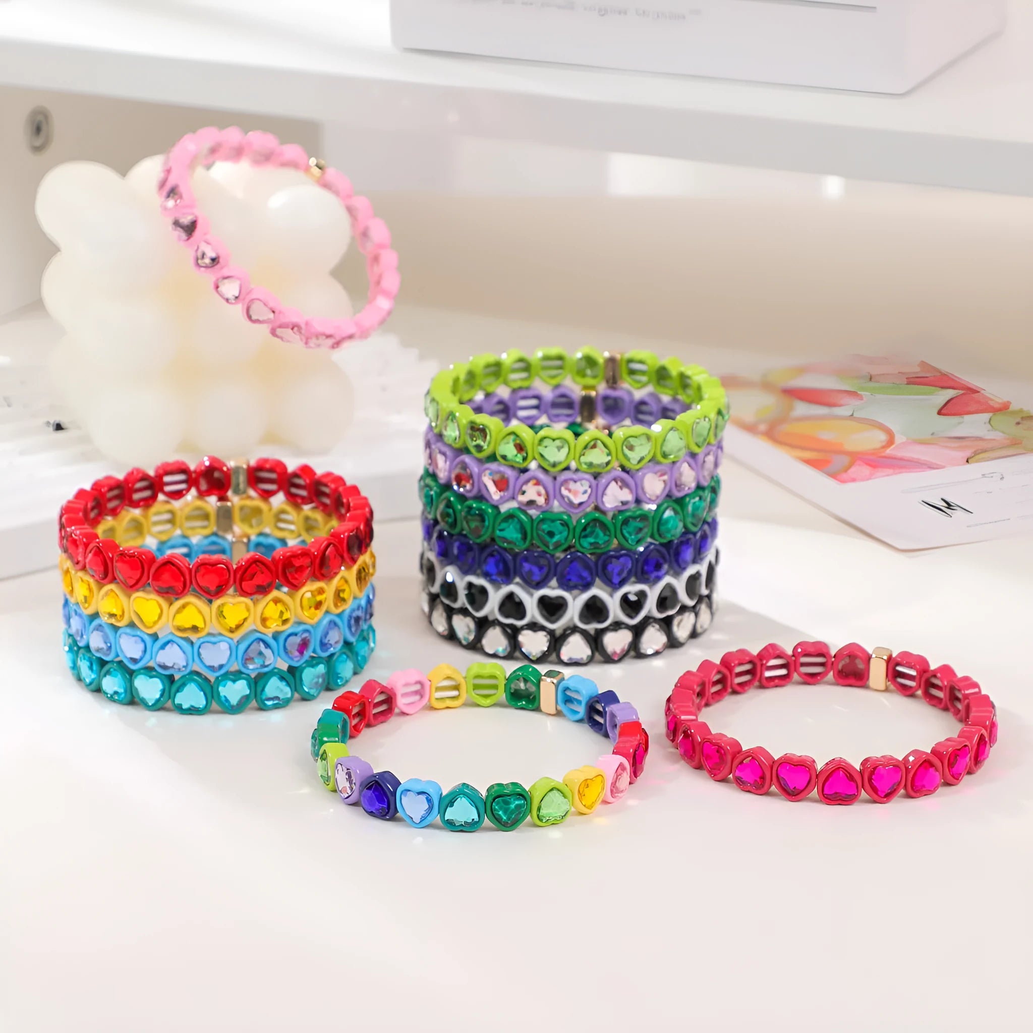 Rainbow coloured enamel heart pendant on stretch bracelet band