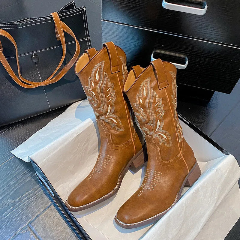 Brown women's embroidered mid-calf Martin boots with a low square heel and round toe.