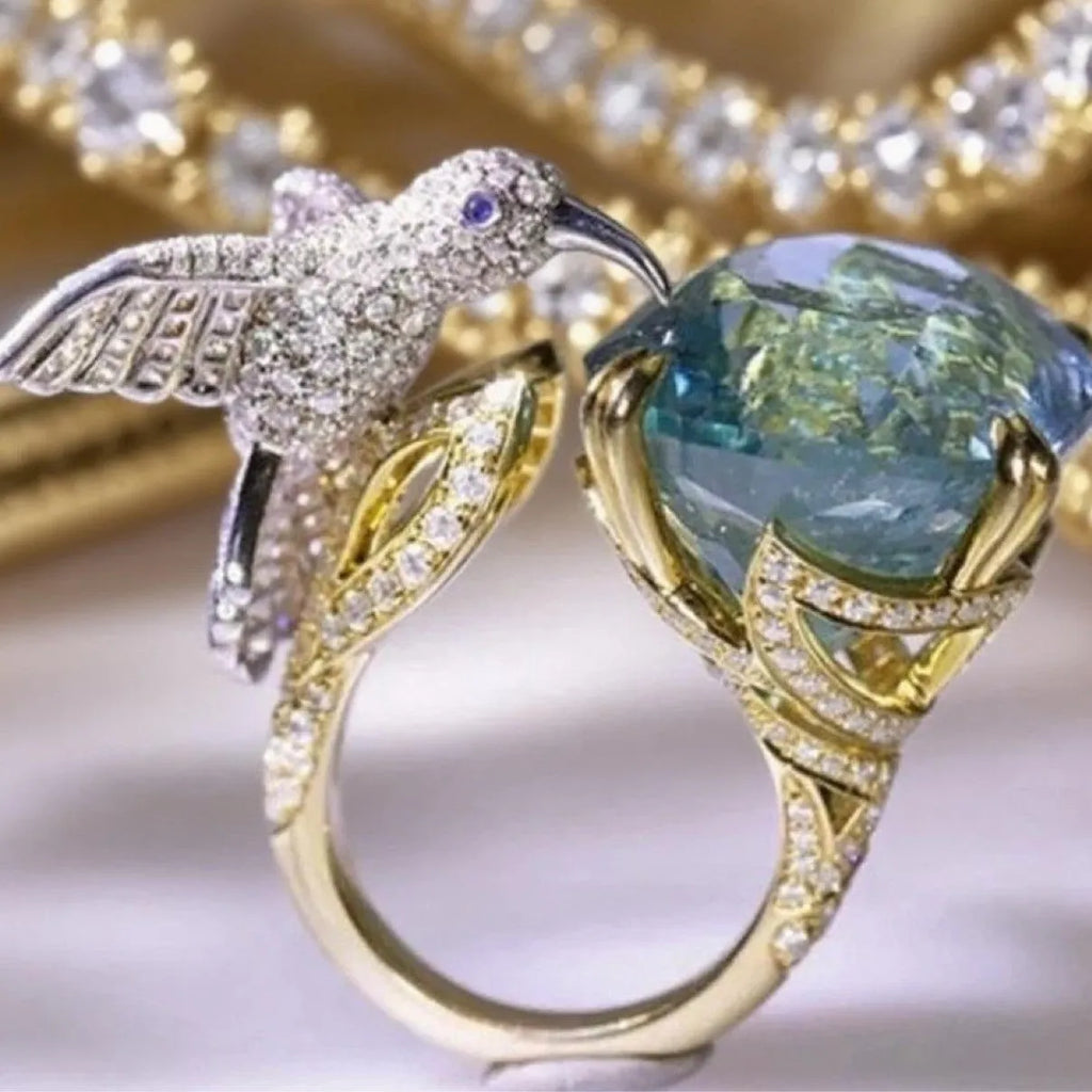 Ocean blue topaz hummingbird shape open ring with real gold colour brass finish and adjustable opening