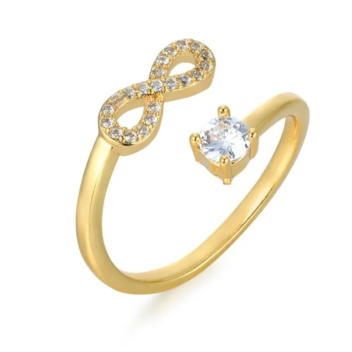 Open geometric ring with a custom 'A' letter made from inlaid zircon stones in a gold metal finish.