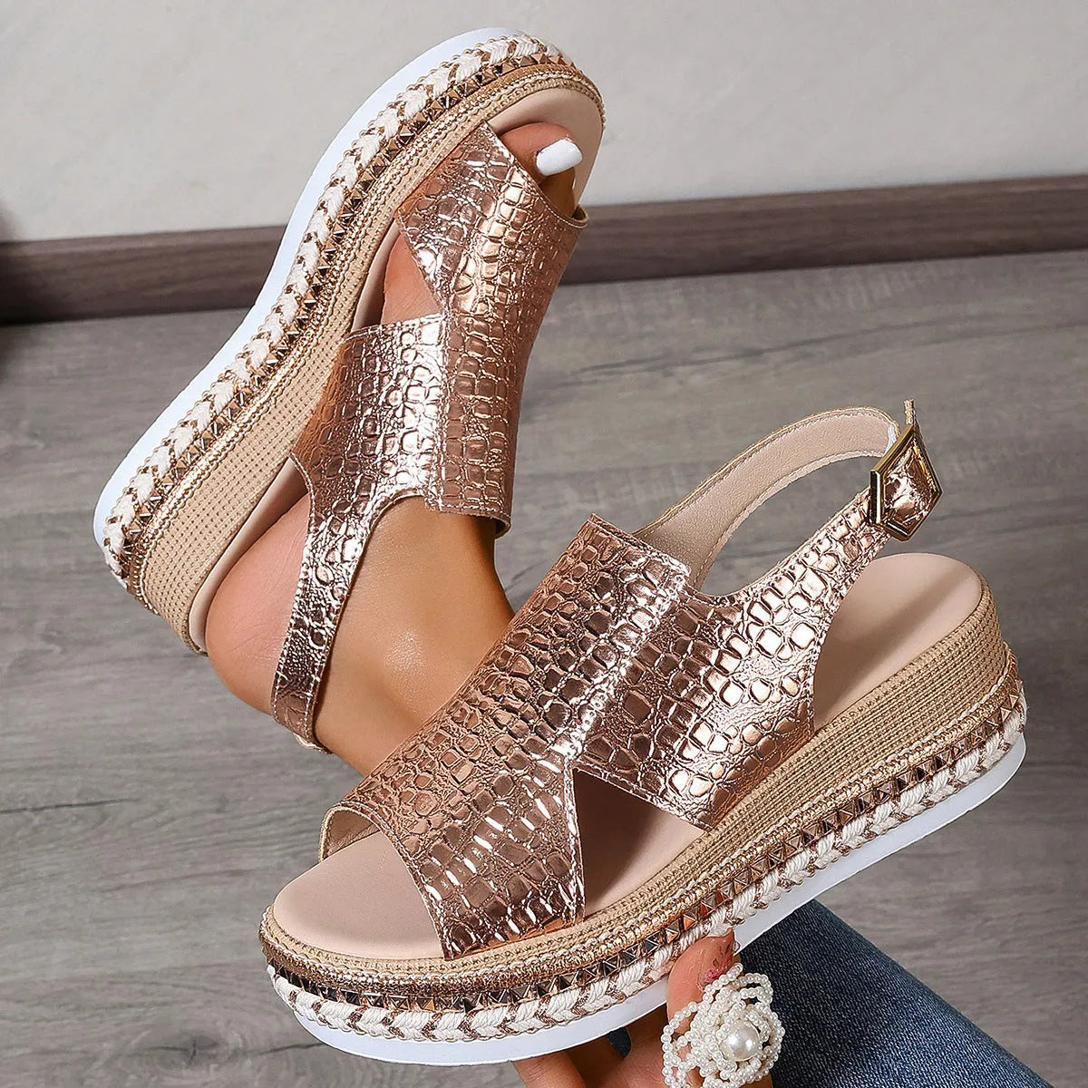 Gold women's Roman sandals with round toe, hollow-out design, and adjustable ankle buckle
