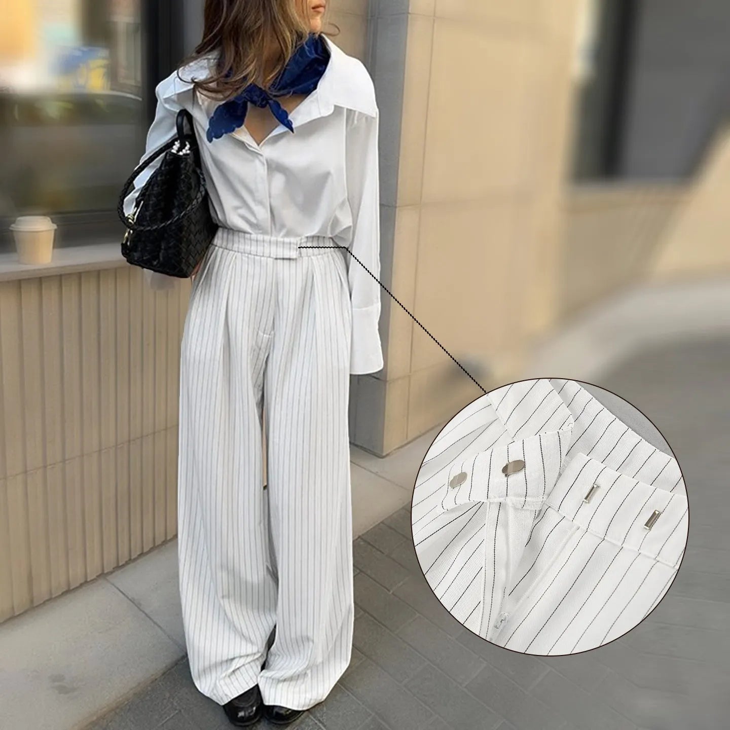 White striped wide-leg casual trousers with a loose fit and zipper detail on a mannequin.