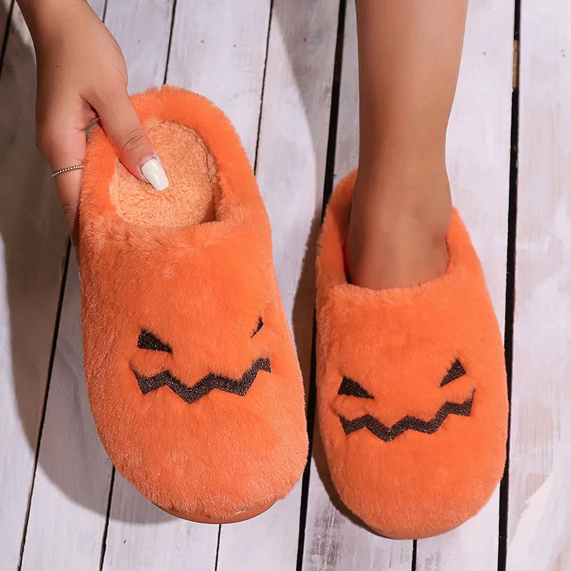 Orange plush Halloween pumpkin slippers with a coral velvet upper and non-slip sole