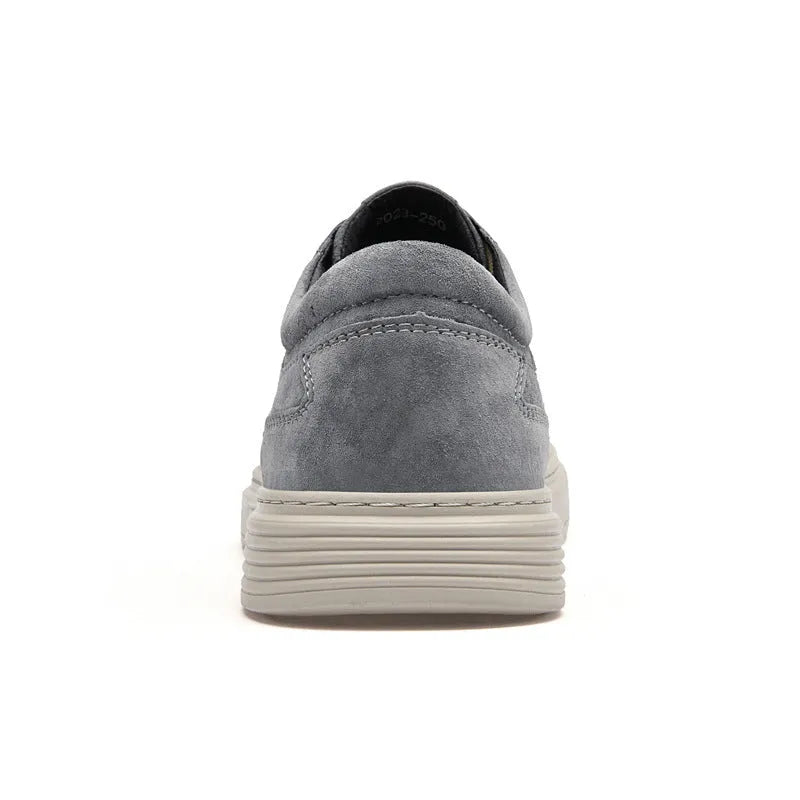 Men's grey casual leather skate shoes with a round toe and front lace-up on a soft rubber sole.