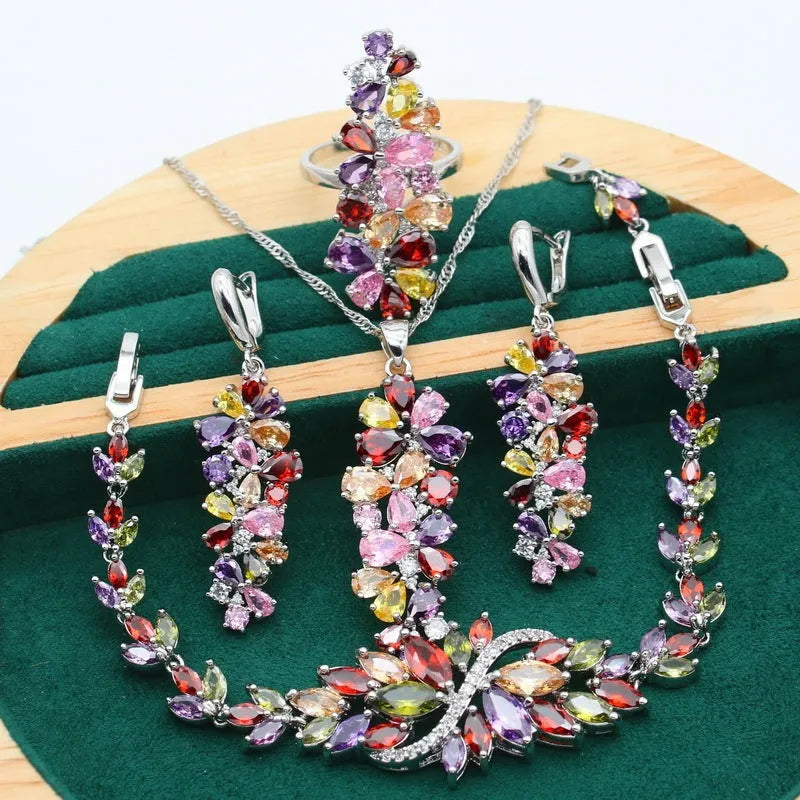 Retro copper zircon jewellery set with floral pattern showing necklace, bracelet, ring, and earrings in olive purple colours