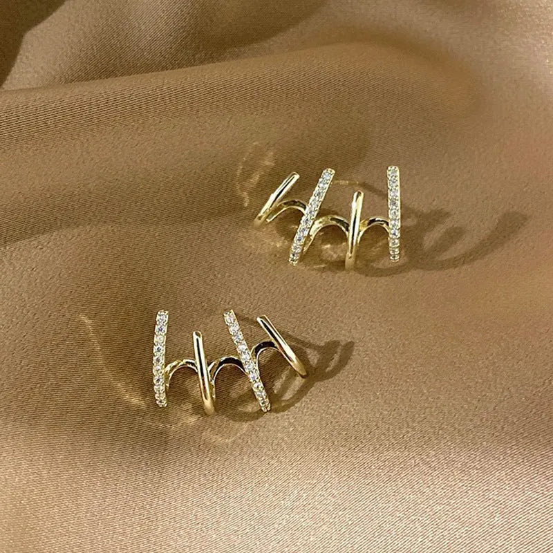 Pair of S925 silver needle four-prong zircon inlaid geometric stud earrings in gold finish
