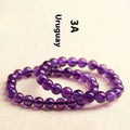Natural Uruguay amethyst scattered bead bracelet showing purple gemstone beads on a string.