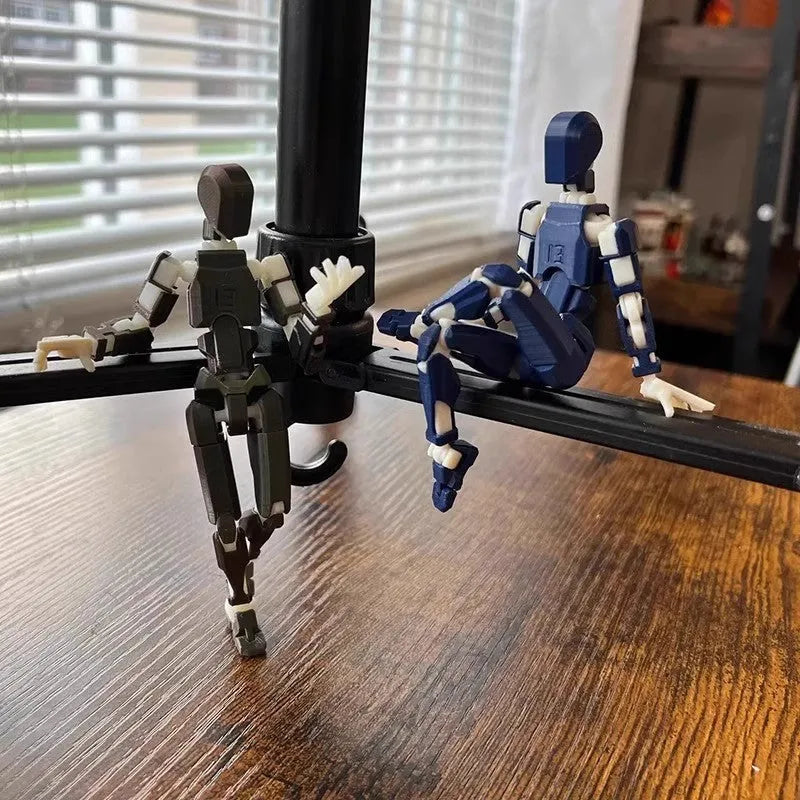 Unassembled 3D printed robot model kit with multi-jointed parts on a table