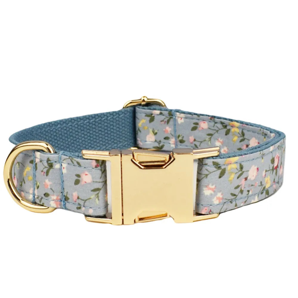 Blue floral pattern dog collar set with matching leash, vest, bow and accessories for small dogs