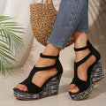 Women's cream white ankle-strap sandals with thick rubber sole and buckle fastening.