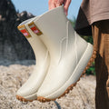 Men's PVC rain boots in black red colour with non-slip plastic soles and round toe design