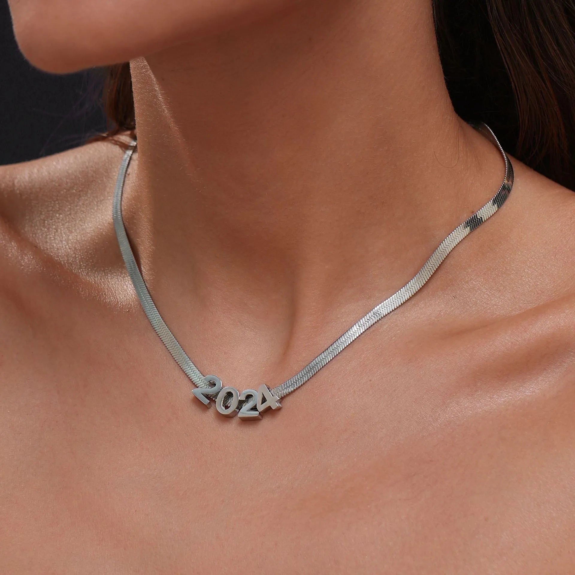 Gold electroplated titanium steel necklace with a single letter A pendant on a 40.5cm blade chain.