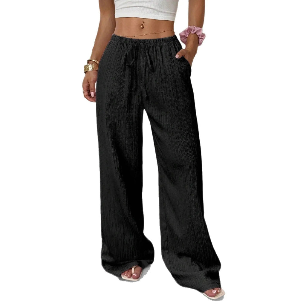 Black wide-leg women's trousers with a lace-up detail on the mid-rise waistband.