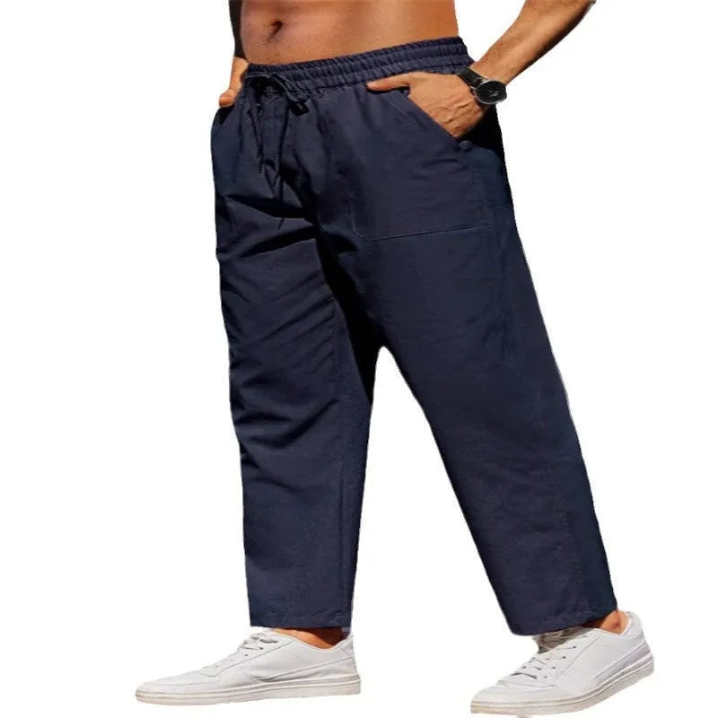 Men's straight leg linen trousers in apricot colour with an elasticated waistband