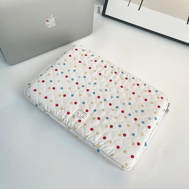 Polka dot patterned polyester laptop bag for women, shown in a solid colour with size options for 11, 13/14, and 15/15.6 inch laptops.