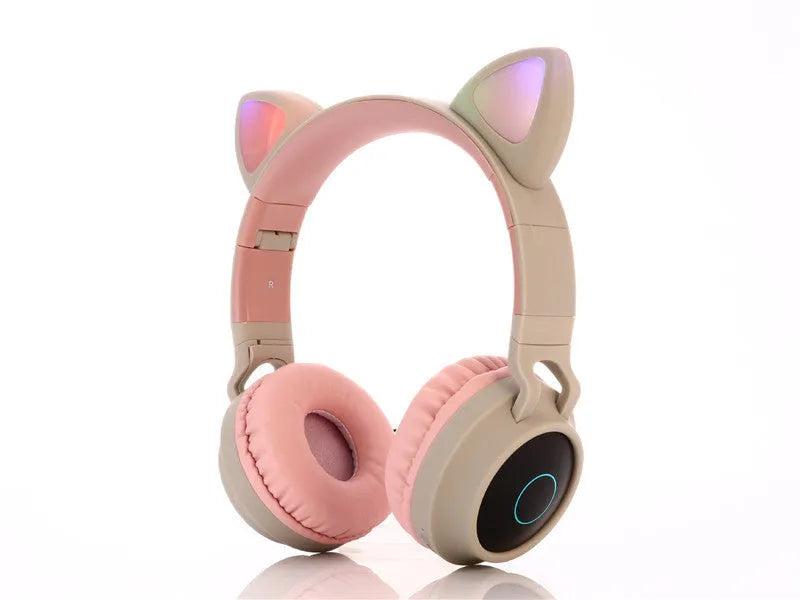 Pink cartoon-style wireless Bluetooth headset with cat ears on the headband, showing bilateral earcups.