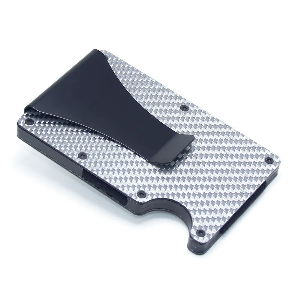 Slim black carbon fibre card holder wallet with geometric design on a gift box.