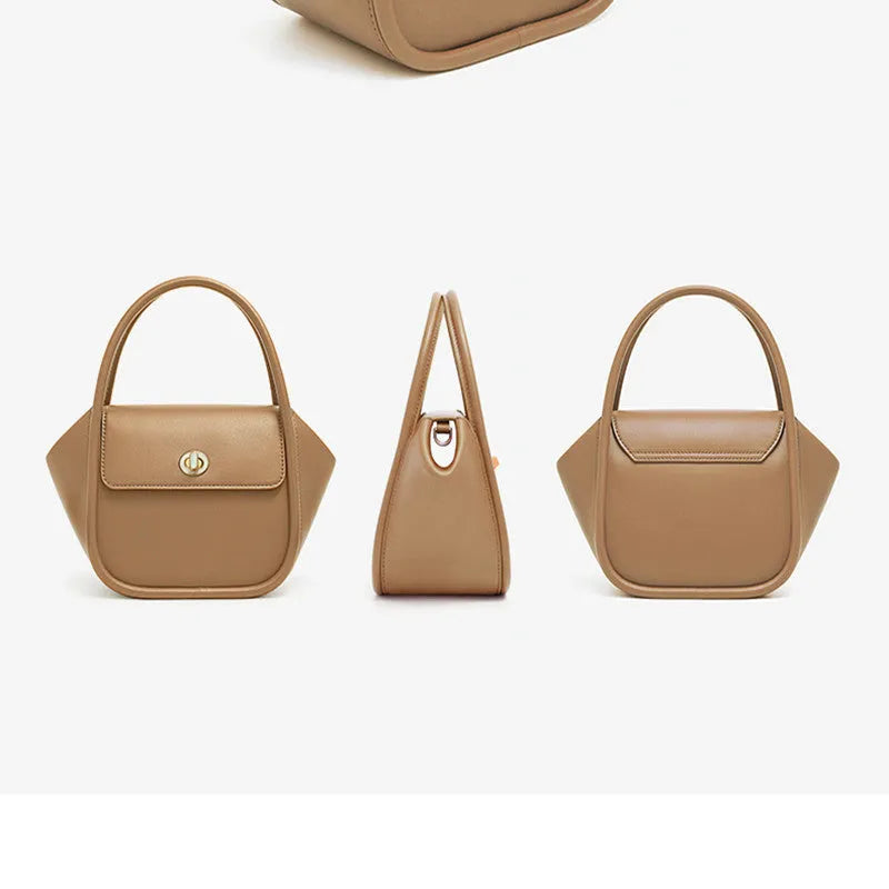 Women's leather wing tote bag in cow leather with a cross-body strap and buckle detail.