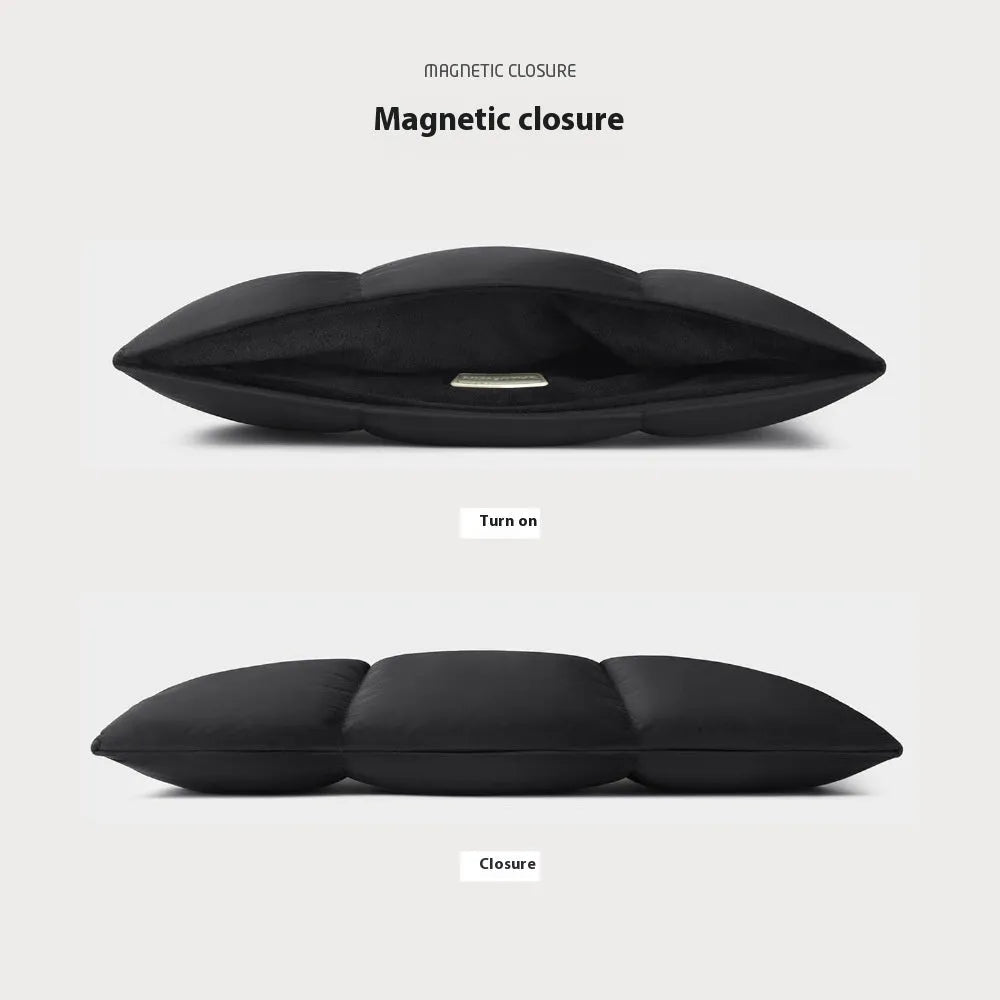 Soft fluffy polyester laptop sleeve in black with visible sewing thread detail, shown next to a laptop.