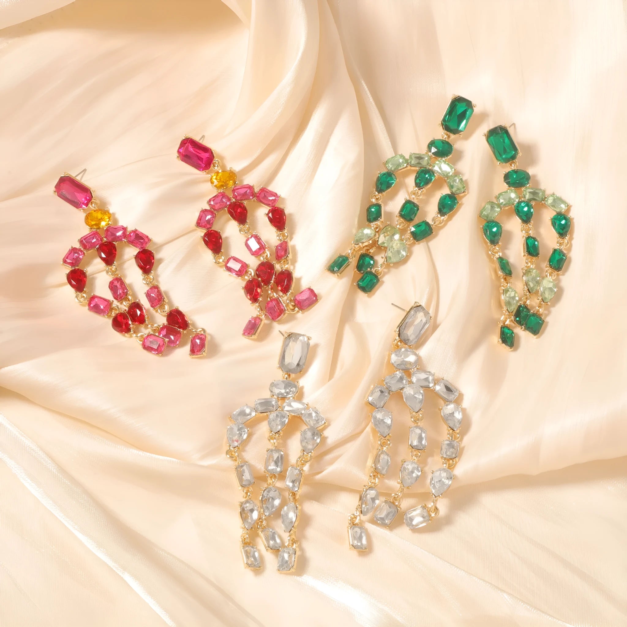 Heavy-duty full-drop diamond teardrop fringe earrings in zinc alloy, green colour, on display
