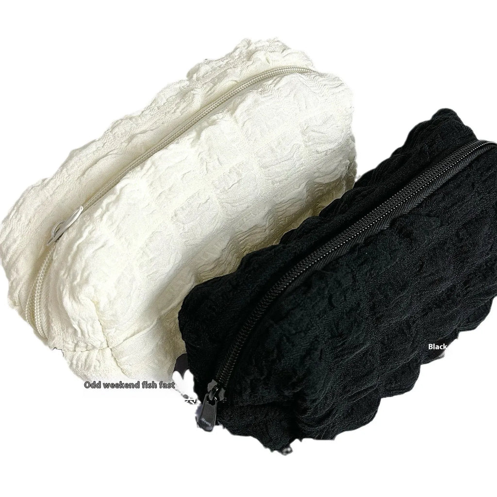 Cream puff design fabric pencil case in beige or black colour made from polyester material