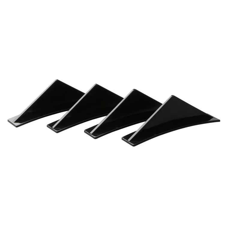 Set of four universal triangle car rear spoilers in ABS plastic, shown in bright black and carbon fibre finishes.